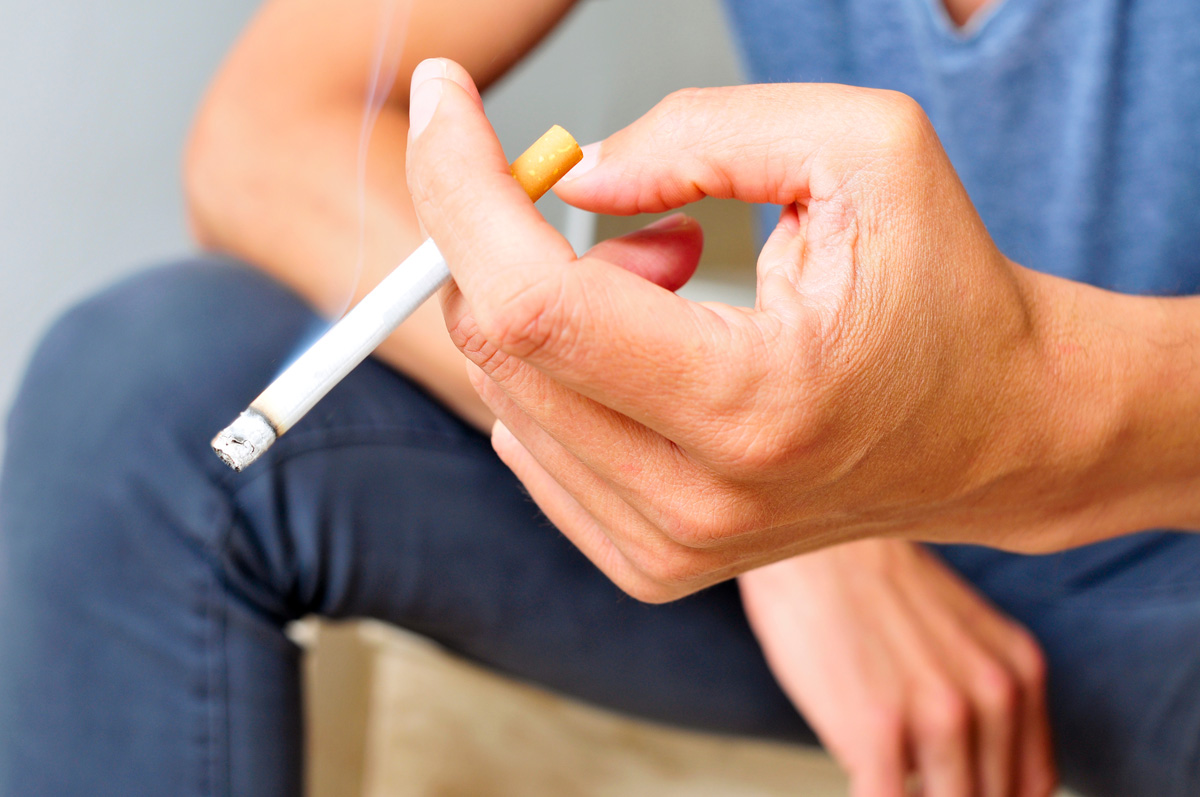 A person holding a cigarette in El Paso.